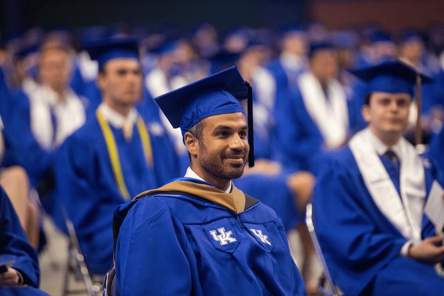 male graduate in cap and gown