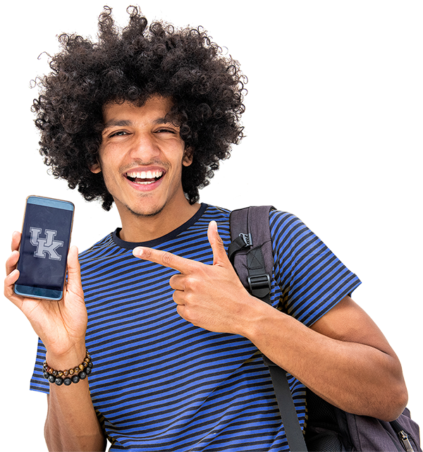 Happy young man holding a mobile phone with a University of Kentucky logo on the screen.