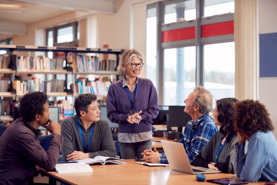 teacher leading others in library