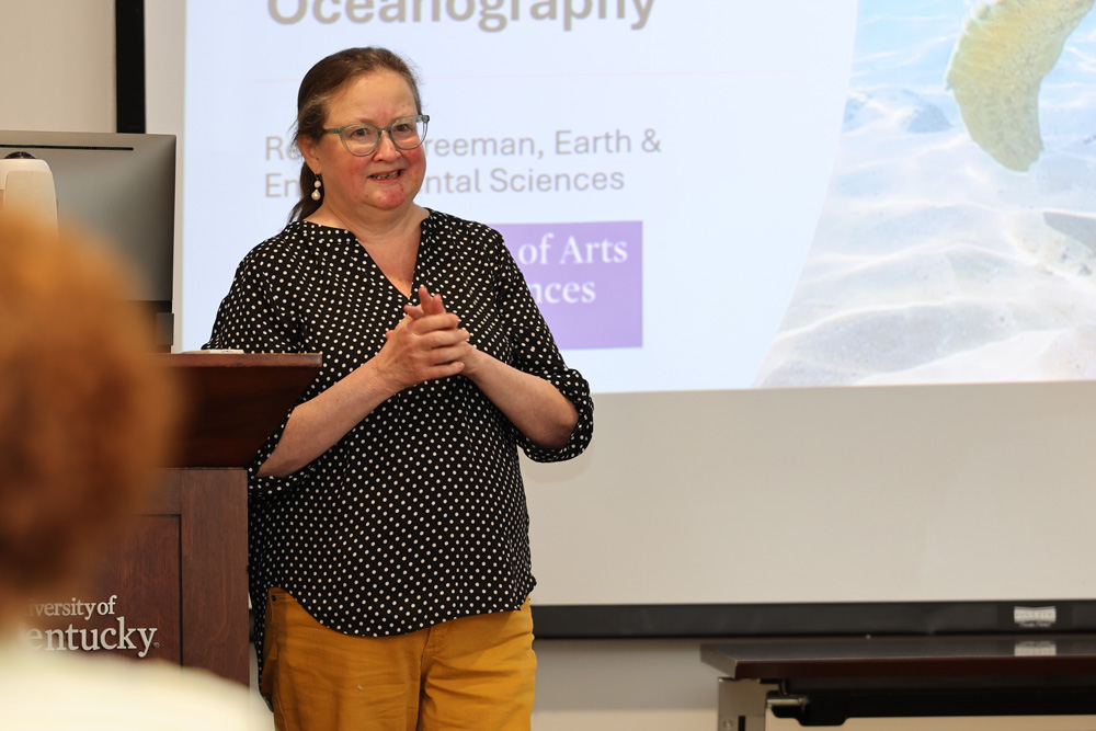 Photo of Dr. Rebecca Freeman sharing her experience re-designing EES 170 during the Course Quality Design Program Showcase.