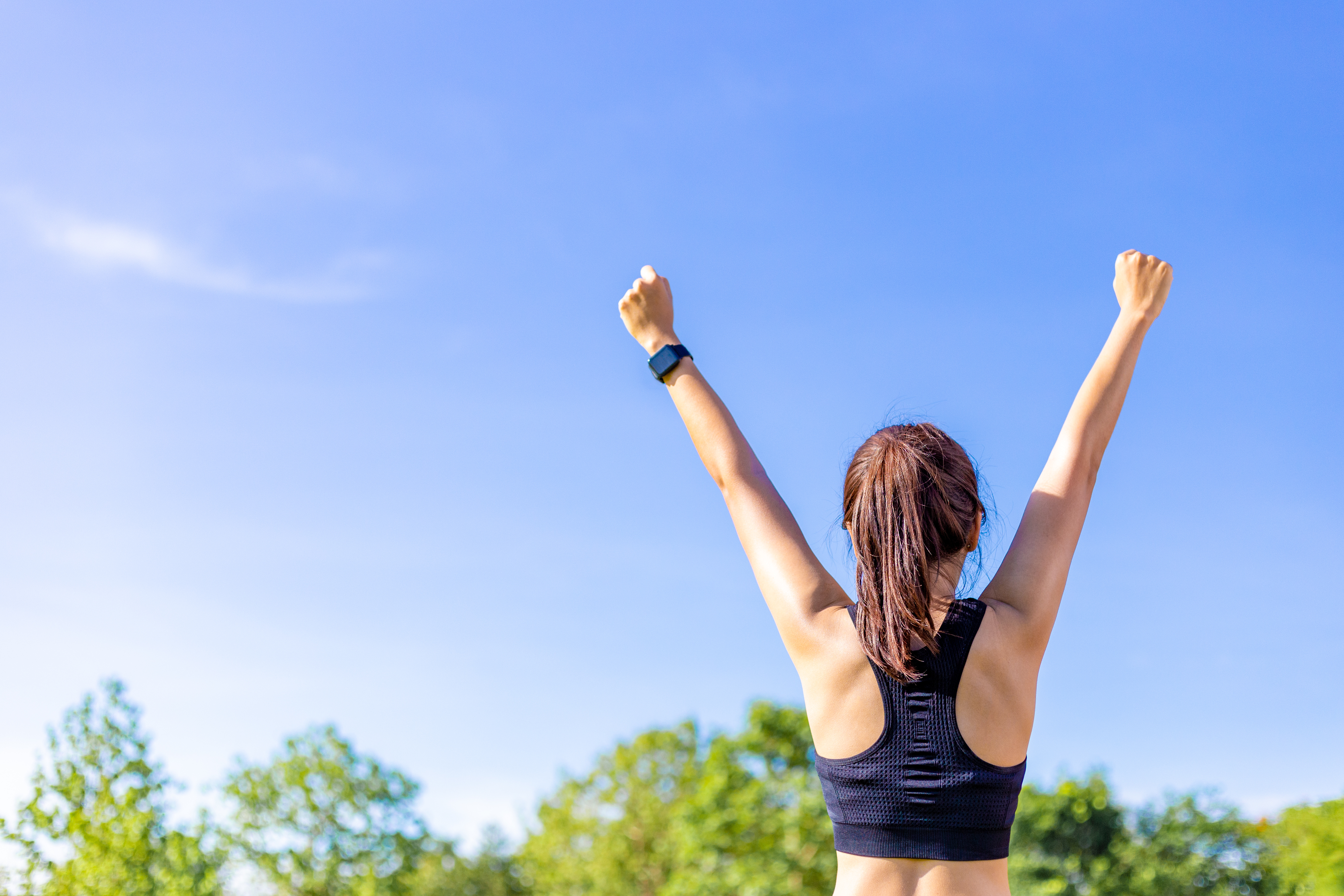 Female celebrating after workout