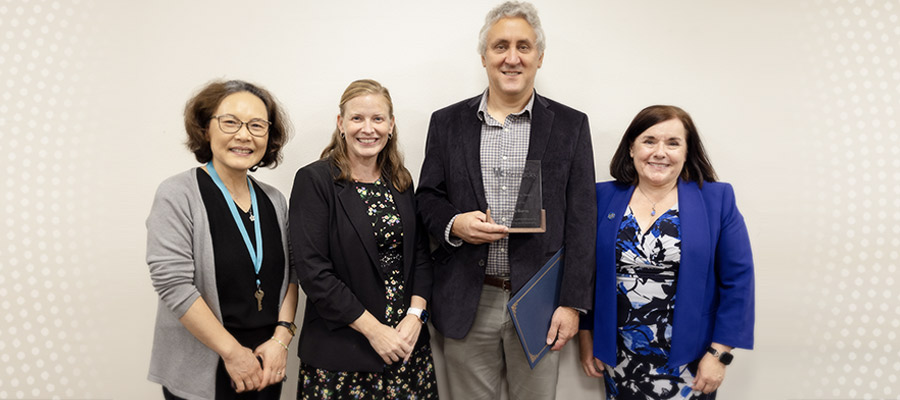 Award winner Sean Burns with supporting faculty and staff