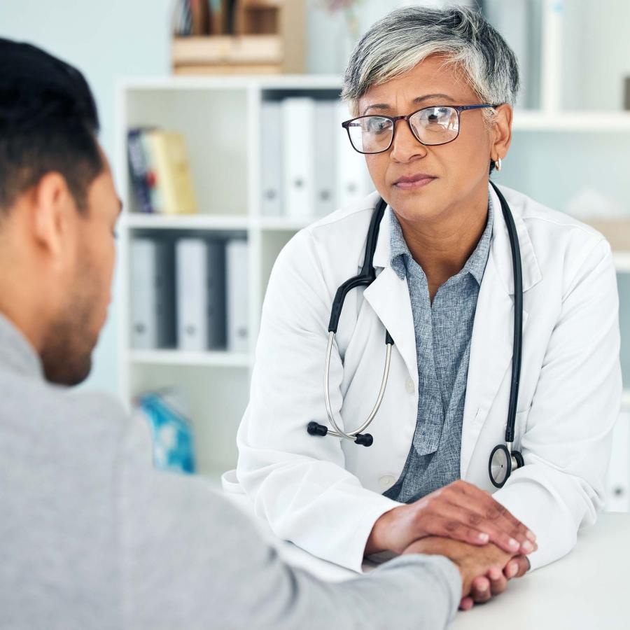 Empathy, sad and holding hands with doctor and patient in hospital for consulting