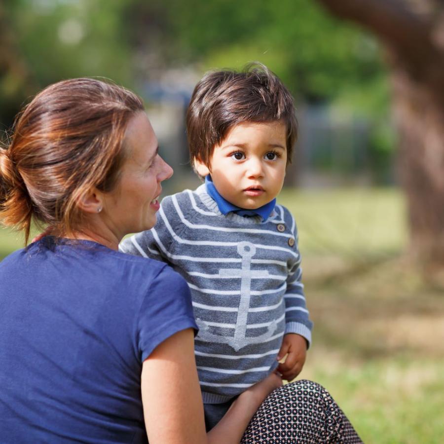 Woman playing with child in park